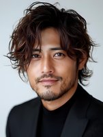 Young Asian male model with tousled dark hair wearing black turtleneck and blazer against light background, displaying confident expression and modern style.