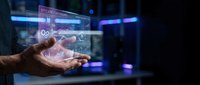 Businessman hand interacting with holographic digital interface displaying data analytics and technology icons in modern workspace environment.