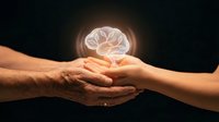 Elderly and young hands gently touching with glowing brain hologram above symbolizing knowledge transfer, mentorship, wisdom sharing between generations.