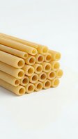 Bunch of uncooked cylindrical pasta tubes arranged in rows on white background, isolated and ready for food packaging, cooking websites, and culinary design projects.