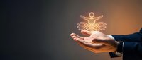 Hands holding glowing neon figure in meditation pose against dark background, representing wellness, mindfulness, personal growth, and spiritual care for health and wellbeing concepts.