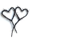 Two intertwined heart shapes drawn with rough black brushstrokes on white background, creating minimalist romantic artwork isolated for design use.