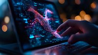 Glowing pink digital graph with downward trend on laptop screen in dark environment with bokeh lights, hand touching interactive financial data display.