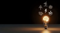 Glowing light bulb with brain filament and renewable energy icons on dark background representing sustainable innovation and green technology solutions.