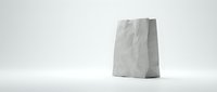 White paper bag standing upright on clean surface with soft lighting and minimal background for packaging and retail design concepts.