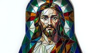 Stained glass portrait of Jesus Christ with colorful geometric patterns and religious symbolism for spiritual and decorative artwork applications.