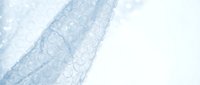 Light blue transparent fabric with delicate circular pattern flowing gracefully against white background for fashion and textile design projects.