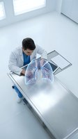 Male doctor examining holographic lung projection in modern medical office for respiratory health diagnosis and treatment planning.