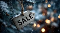 Wooden SALE tag hanging on snowy pine branch with festive bokeh lights in background, creating holiday shopping atmosphere.