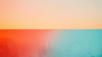 Vibrant gradient abstract background with coral red transitioning to turquoise blue, featuring soft color blending and subtle texture for modern design projects.