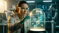Female scientist examining glowing DNA helix under glass dome in modern laboratory. Genetic research, biotechnology innovation concept.
