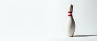 Isolated white bowling pin with red stripe on clean background, ready for design projects, sports graphics, and recreational activity illustrations.