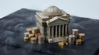 Classical bank building model with golden coins stacks representing financial institution, investment banking, monetary system and economic growth concept.