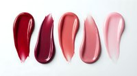 Five glossy lipstick swatches in red to pink gradient tones on white background, cosmetic makeup color palette for beauty and fashion applications.