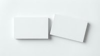Two blank white business cards mockup on light gray background with soft shadows for branding and corporate identity design presentation.