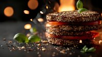 Layered grilled beef patties with fresh tomato slices and basil leaves on dark background with bokeh lights and flying seasonings, dramatic food photography.