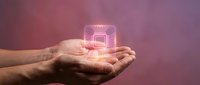 Hand holding glowing neon square with radiating lines against purple gradient background, representing technology, innovation, and digital transformation concepts.