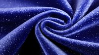 Mesmerizing spiral pattern of dark blue velvet fabric with glittering sparkles and shimmering texture creating an abstract cosmic swirl effect. Luxury textile background.