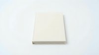Blank white hardcover book with clean cover isolated on white background for mockup and design projects.