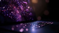 Magical purple glowing particles floating above dark surface with bokeh light effects and sparkles creating dreamy atmospheric composition.