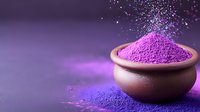 Vibrant purple powder spilling from clay bowl on dark background with magical sparkle effect, creating mystical atmosphere for wellness and spa concepts.