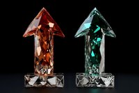 Crystal arrows pointing upward in red and turquoise colors on black background, geometric faceted design with translucent glass-like appearance and dramatic lighting.