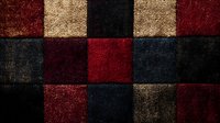 Colorful fabric textile samples arranged in checkerboard pattern showing various textures and weaves in red, blue, beige and brown tones for interior design.