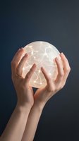 Hands holding glowing digital globe with connected network lines against dark background, representing global communication, technology, and worldwide connectivity for business concepts.