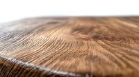 Extreme close up of natural wood grain texture showing detailed organic patterns and curves in brown oak surface, macro photography for interior design background.