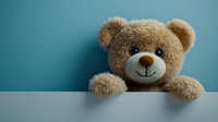 Adorable brown teddy bear peeking over white surface against turquoise blue background, soft plush toy with innocent expression for children's room decor.