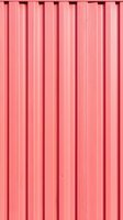 Vertical pink metal siding creates geometric pattern of parallel lines and ridges. Industrial corrugated surface with light and shadow detail for modern design background.