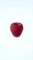 Fresh red raspberry isolated on white background, ready for food and beverage design, packaging, and culinary projects.