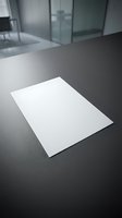Blank white paper sheet on dark desk in modern office interior for business presentations and corporate communications.