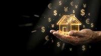 Golden house model floating above cupped hands with currency symbols on dark background representing real estate investment and property finance concepts.