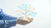 Businessman hand holding glowing tree with connected technology icons representing digital innovation, network growth, and smart business solutions for corporate development.