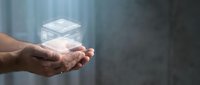 Male hand holding glowing digital cube hologram, representing technology, innovation, and data storage solutions for business and corporate applications.