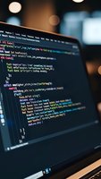 Software developer coding on laptop screen with colorful syntax highlighting in modern office environment for programming and web development projects.