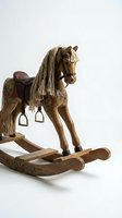 Vintage wooden rocking horse toy with floral painted details and rope mane isolated on white background for children playroom and nursery decor.
