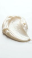 Creamy white moisturizer or face cream swirl on clean background for skincare and beauty product advertising and cosmetic packaging design.
