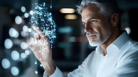 Mature businessman with gray beard touching holographic digital interface with glowing particles in modern office environment for technology presentations.