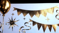Golden festive party decorations with metallic bunting flags, shiny balloon and starburst on white background, celebration design elements for greeting cards.