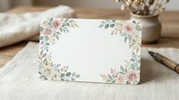 Blank greeting card with watercolor floral border featuring pink roses and green foliage on cream background, suitable for weddings, invitations, and stationery design.