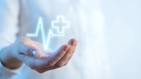 Glowing neon heartbeat and medical cross symbol floating above open hand, representing healthcare, wellness, and digital medicine services for medical professionals.