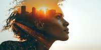 Double exposure portrait of African American woman with urban cityscape and sunset silhouette, symbolizing inner strength and vision.