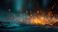 Abstract water splash with glowing orange particles and bokeh lights creating dynamic motion effect against dark teal background for creative projects.