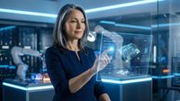 Woman engineer interacting with holographic display showing circuit board design in modern tech laboratory environment for innovation and technology concepts.