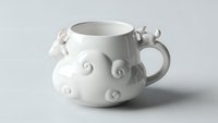 White ceramic teapot with decorative swirl patterns and curved handle on neutral background for kitchen and dining concepts.