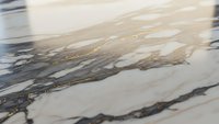Elegant marble surface with golden veins and natural stone patterns for luxury interior design and architectural applications.