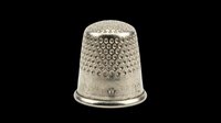 Silver metal thimble with dotted texture, isolated on transparent background. Ready for sewing clipart, craft stickers, print on demand, sublimation, and t-shirt design use.