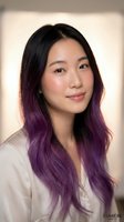 Young Asian woman with long black hair featuring purple ombre tips smiling confidently in casual white shirt against soft neutral background for lifestyle content.